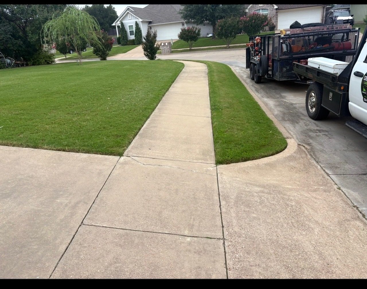 Clean edged lawn along driveway